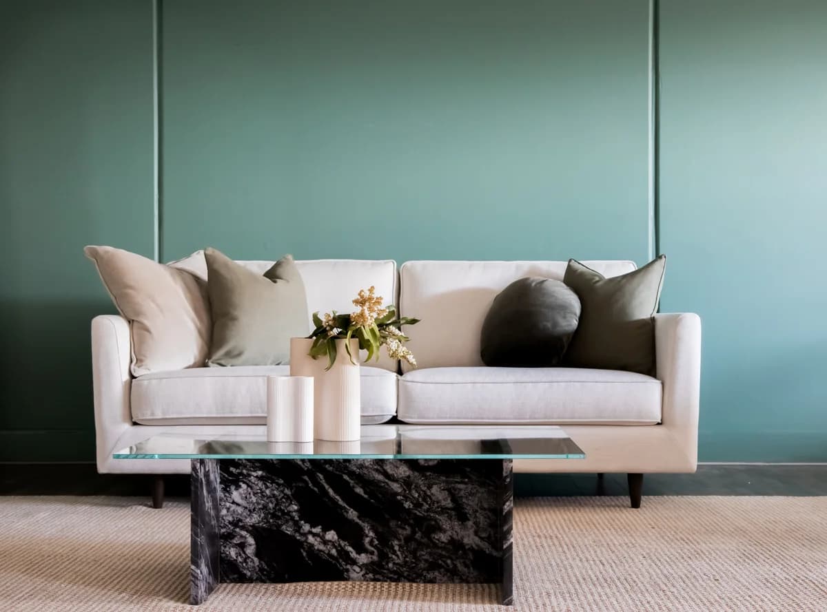 Calm living space with a green sofa